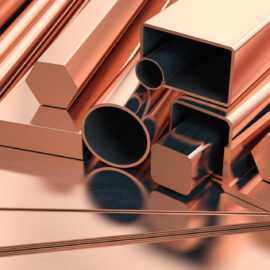Copper tubes and different profiles in warehouse background. Different copper metal rolled products. 3d illustration